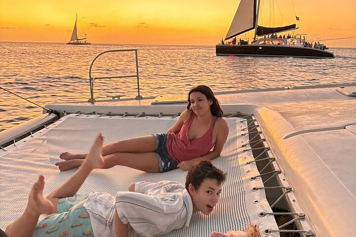 Guests stretched out on the trampoline as the sun goes down off the west coast